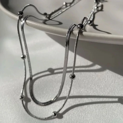 گردنبند دولاین زنجیر توپی و ماری استیل در دورنگ طلایی و نقره ای رنگ ثابت
