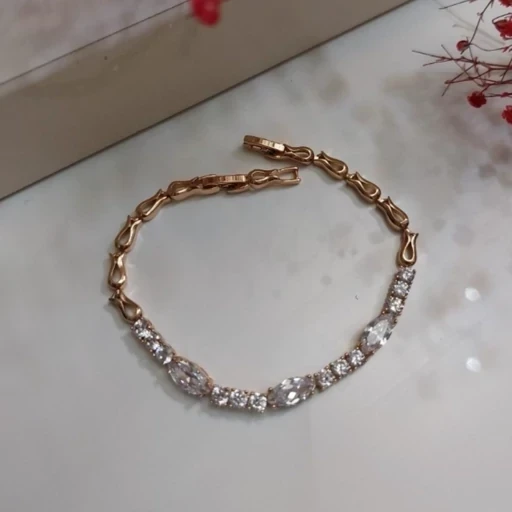 دستبند زنانه نگیندار برند ژوپینگ قفل ساعتی طلایی