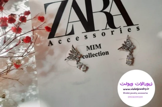 گوشواره میخی طرح پروانه نقره ای رنگ ثابت کد 1115