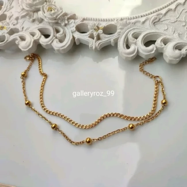 دستبند  پابند زنانه ظریف ترکیب کارتیر و زنجیر توپی جنس استیل (ویولت گالری) کد 7082
